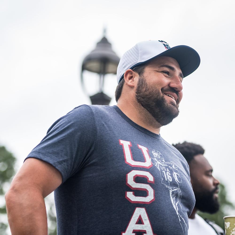 Navy t-shirt with "USA" and a lacrosse player graphic.