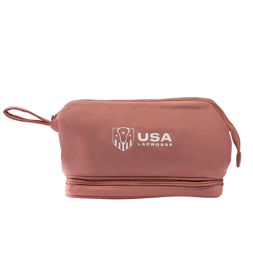 Pink toiletry bag with USA Lacrosse logo printed on the side.