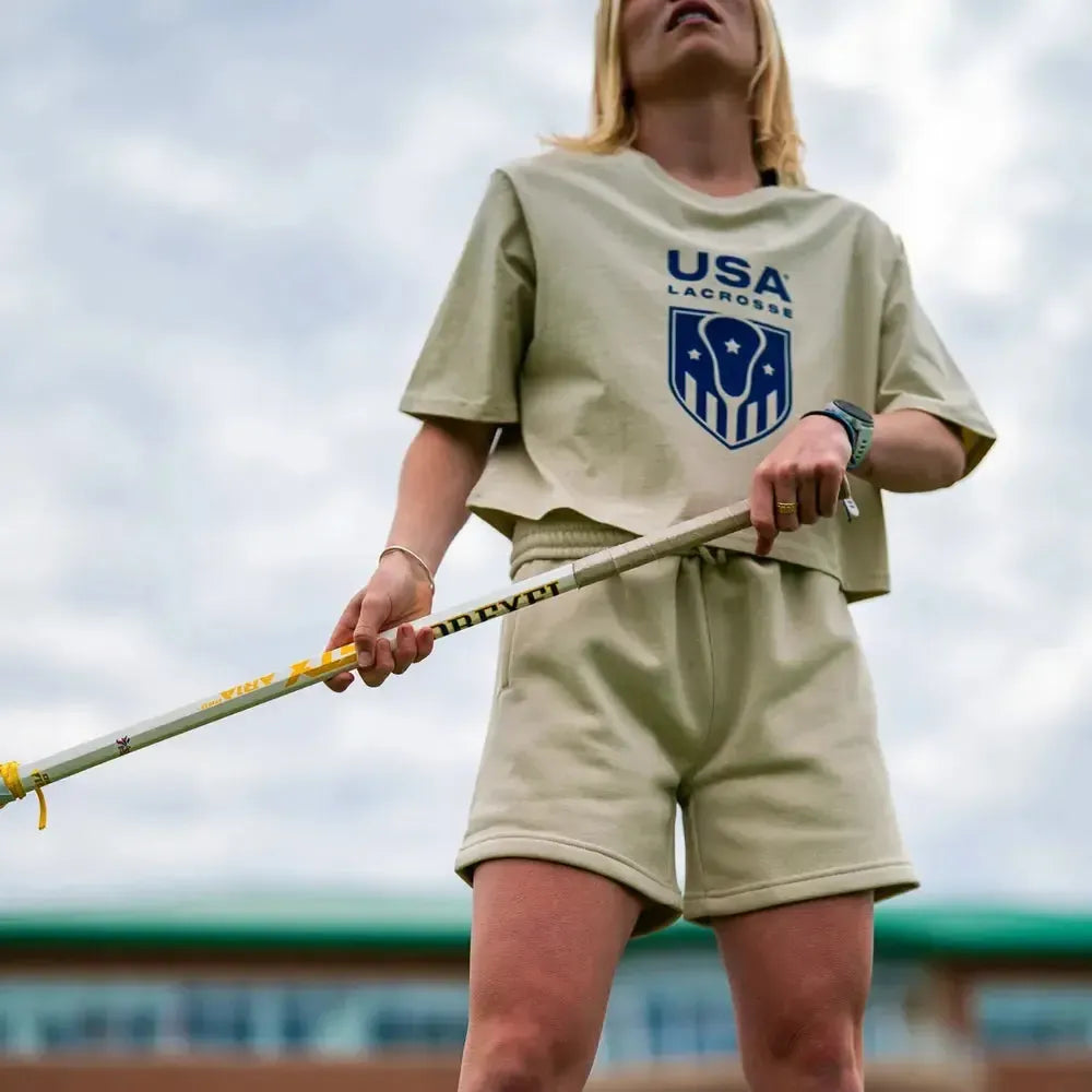 Beige T-shirt with USA Lacrosse logo on the front.